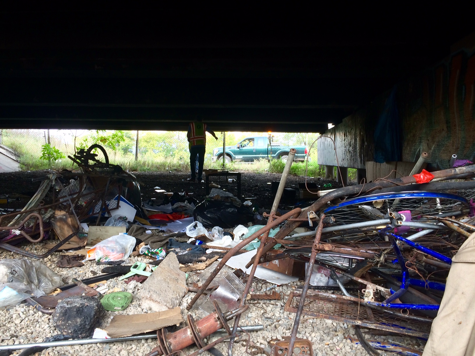 A homeless encampment under I-394 the day after a MnDOT "bridge cleaning." (credit: CBS)