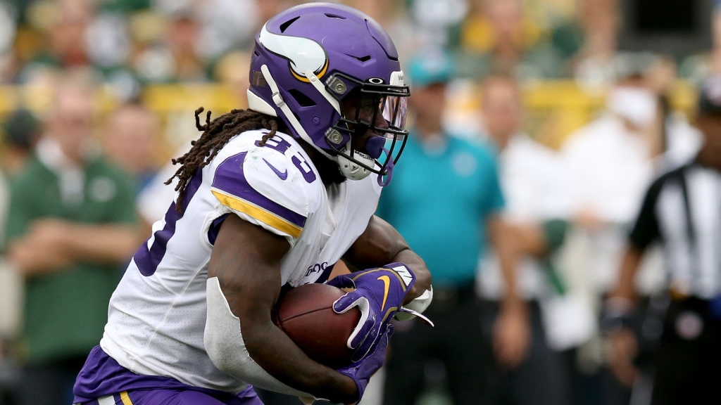 Running back Dalvin Cook #33 of the Minnesota Vikings runs the ball against the Green Bay Packers in the game at Lambeau Field on September 15, 2019 in Green Bay, Wisconsin.